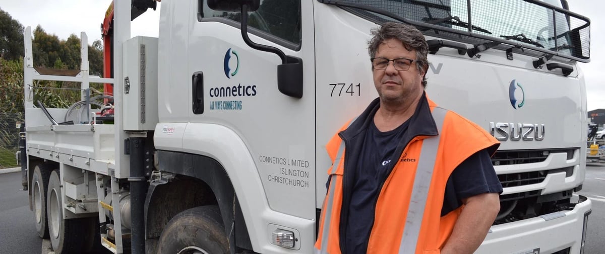 Photo of Wayne Muiznieks, Fleet Coordinator, Connetics, with a Crane Truck fitted with the MAX-SAFE Anti-Rollaway Brake System
